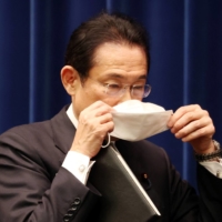 Prime Minister Fumio Kishida leaves a news conference in Tokyo on Dec. 21. | POOL / VIA REUTERS
