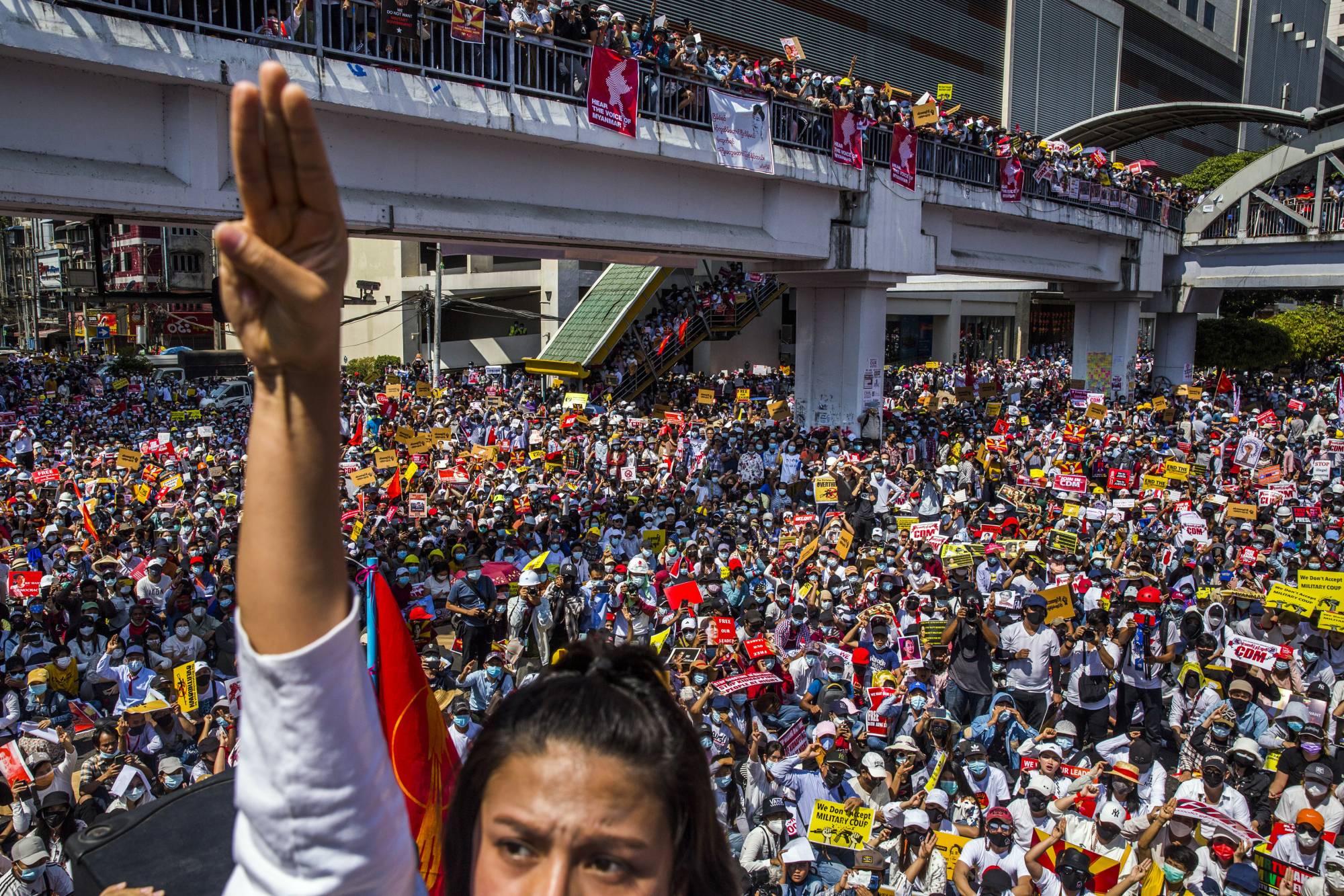 Actress Paing Phyoe Thu holds up the three-finger salute, a symbol from the 
