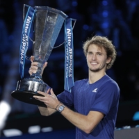 Alexander Zverev celebrates with the trophy after winning the ATP Finals in Turin, Italy, on Nov. 21. | REUTERS