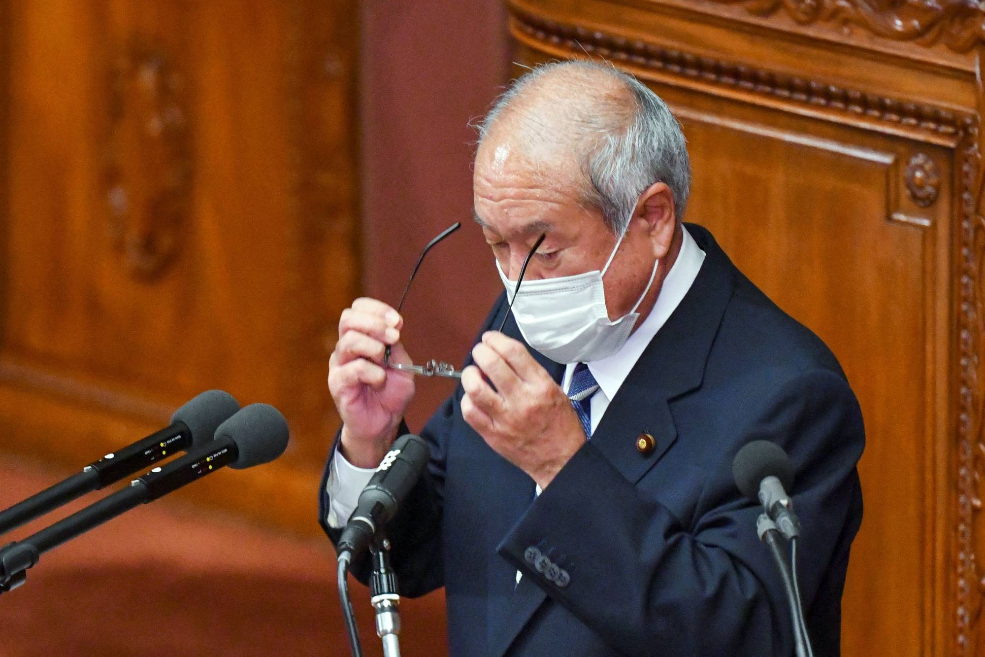 Finance Minister Shunichi Suzuki prepares to deliver a speech at parliament in Tokyo on Dec. 6. | AFP-JIJI