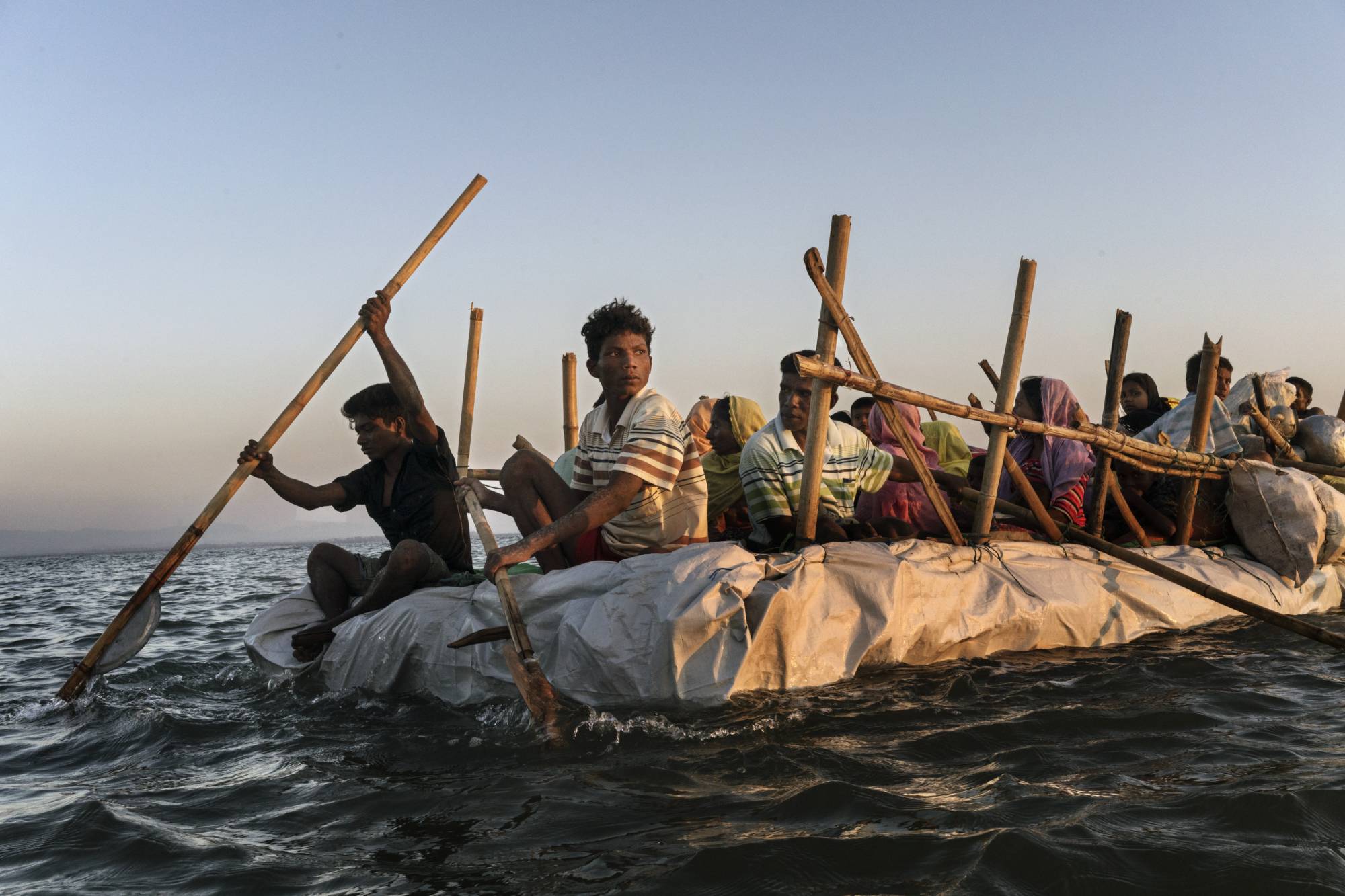 Rohingya refugees cross the Naf River, which divides Bangladesh and Myanmar, in 2017. | Adam Dean / The New York Times
