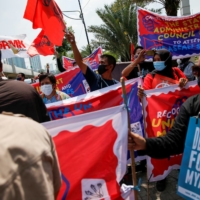 Protesters march in support of the anti-coup movement and democracy in Myanmar  ahead of the ASEAN leaders\' meeting in Jakarta on April 24. | REUTERS