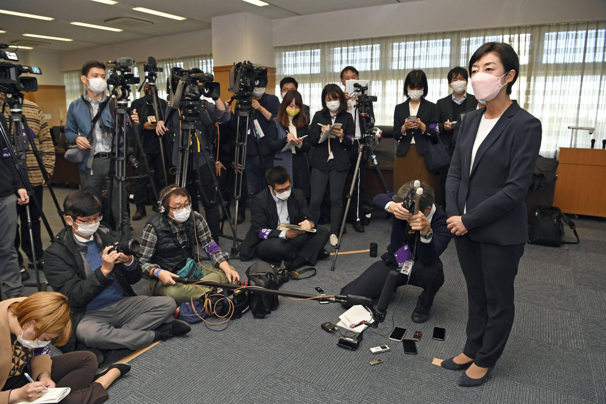 Musashino Mayor Reiko Matsushita speaks to reporters on Dec. 21 after the city assembly rejected her proposal to allow foreign residents to vote in local referendums. | KYODO