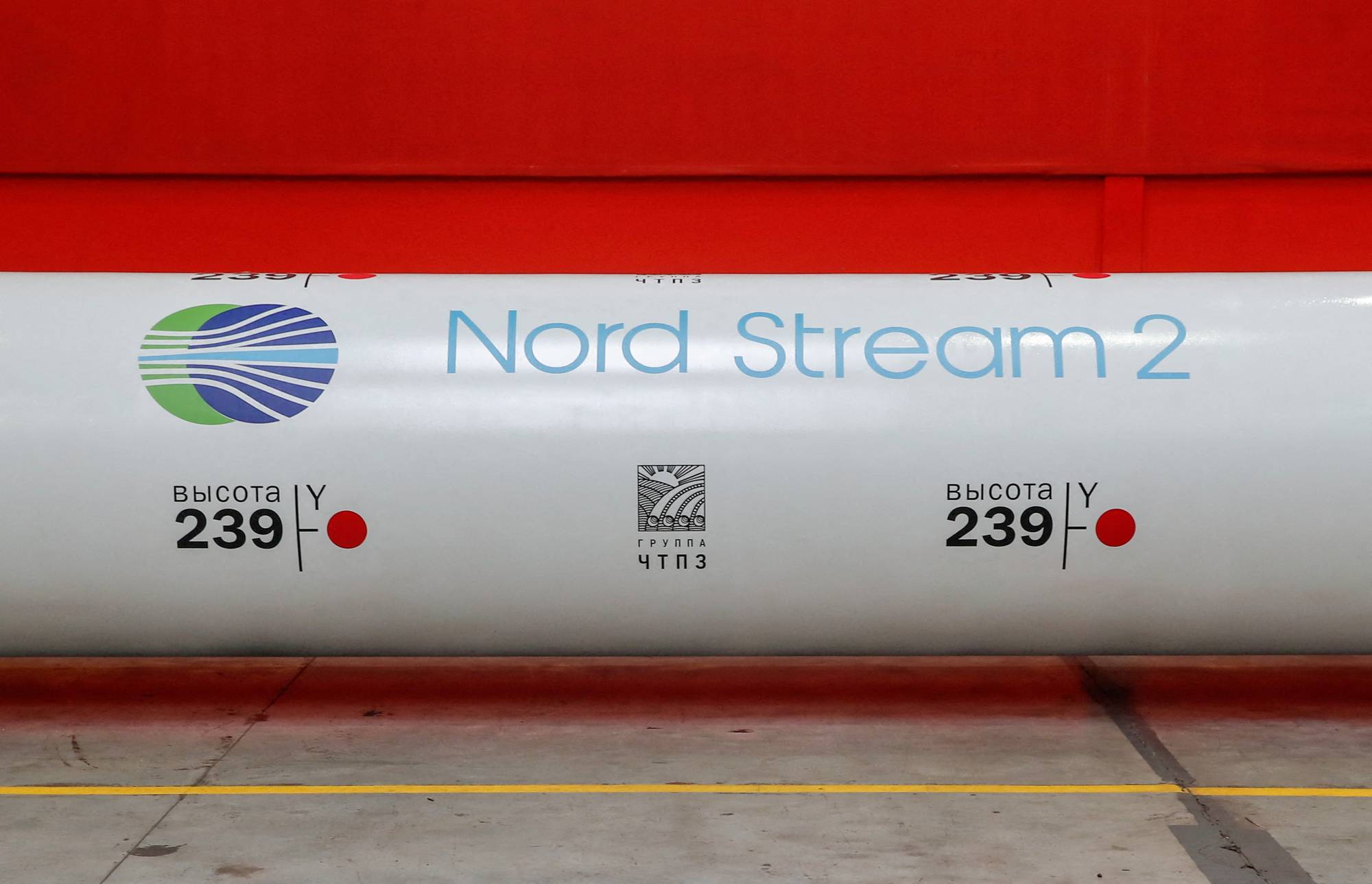 The logo of the Nord Stream 2 gas pipeline project on a pipe at a ChelPipe Group plant in Chelyabinsk, Russia, in February 2020. | REUTERS