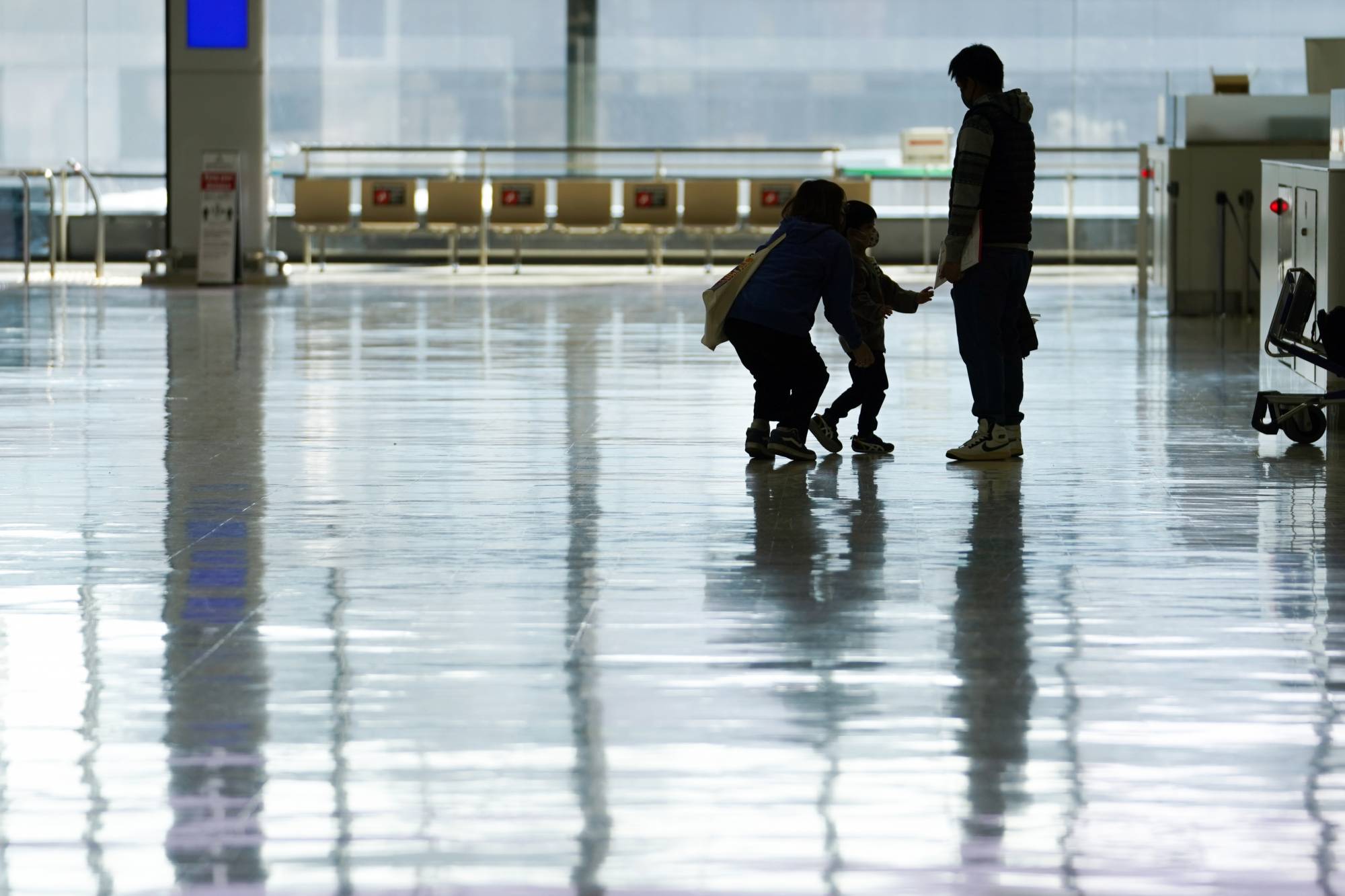 Travelers in a departure hall at Narita Airport in Chiba Prefecture on Nov. 30 | BLOOMBERG