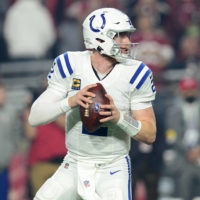 Indianapolis Colts quarterback Carson Wentz drops back to pass against the Arizona Cardinals on Sunday. Wentz, who admittedly has not been vaccinated, was placed on the COVID reserve list.  | JOE CAMPOREALE / USA TODAY / VIA REUTERS