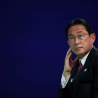 Prime Minister Fumio Kishida waits before speaking at the U.N. COP26 climate conference in Glasgow, Scotland, on Nov. 2. | POOL / VIA REUTERS