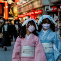 Visitors near Sensoji temple in Tokyo on Dec. 24. | REUTERS