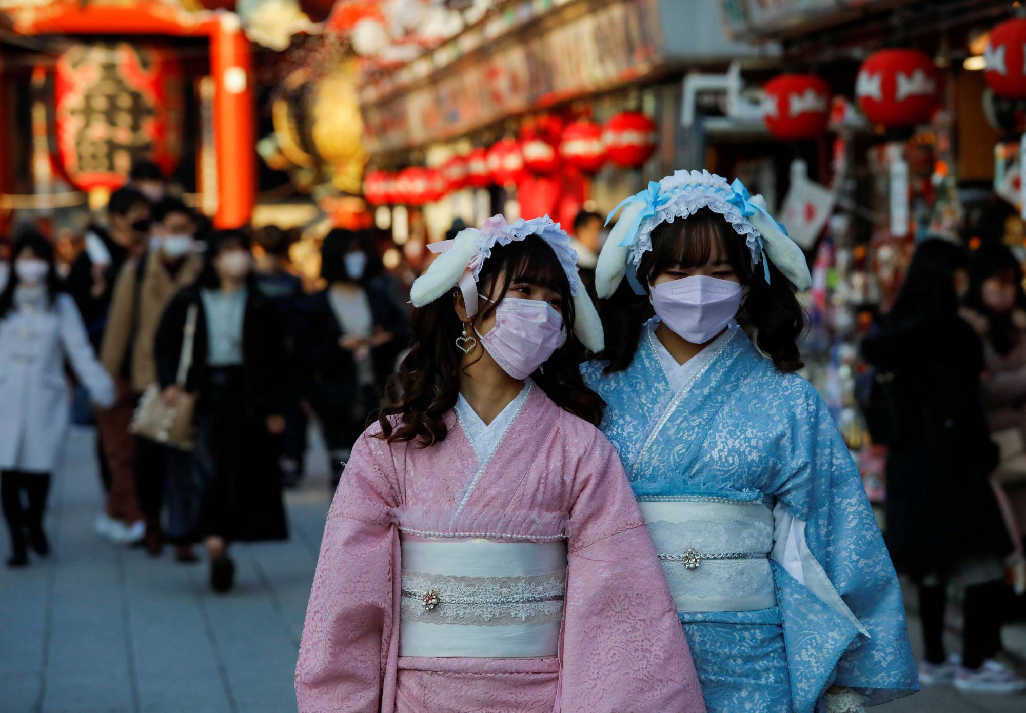 Visitors near Sensoji temple in Tokyo on Dec. 24. | REUTERS
