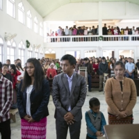 Biak Tling and his family attend church in Farkawn, India, on Dec. 12.  | SAUMYA KHANDELWAL / THE NEW YORK TIMES