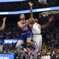 Golden State Warriors guard Stephen Curry drives to the basket versus the Denver Nuggets at the Chase Center on Tuesday. | D. ROSS CAMERON / USA TODAY / VIA REUTERS