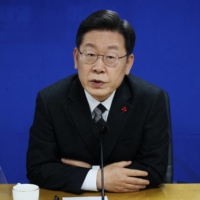 Lee Jae-myung, the 2022 presidential election candidate of the ruling Democratic Party, answers questions during an interview with foreign media in Seoul on Dec. 29. | REUTERS