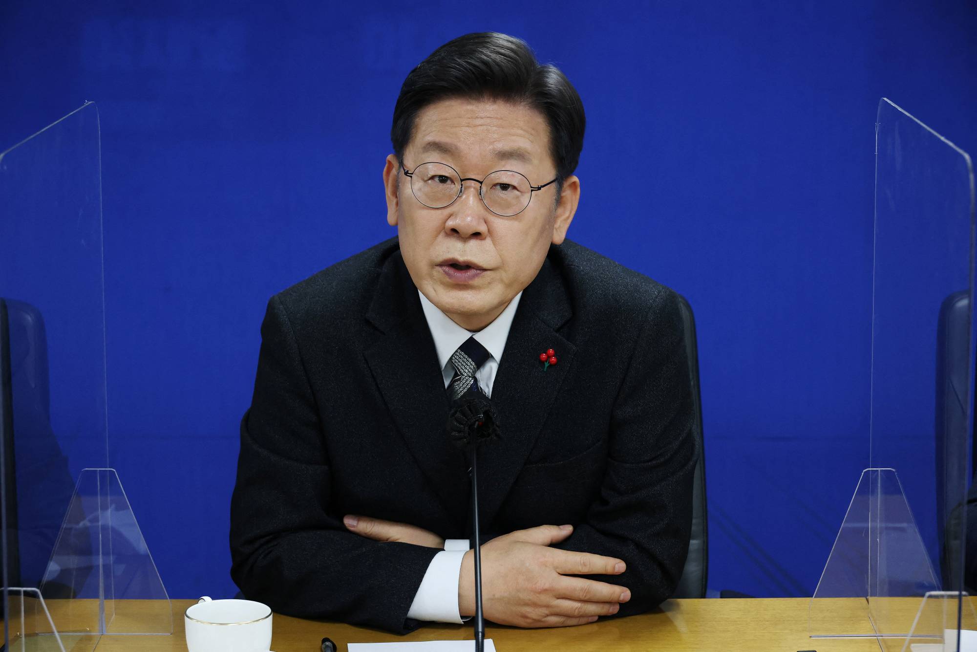 Lee Jae-myung, the 2022 presidential election candidate of the ruling Democratic Party, answers questions during an interview with foreign media in Seoul on Dec. 29. | REUTERS