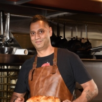 Bunny Ranga Khus has returned to his roots in his cooking, which is now mostly Asian barbecue with Indian, Chinese, Korean and Filipino fusion dishes | TSUYOSHI TAGAWA
