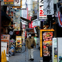 Though cases are low and almost all emergency measures have been lifted in Japan, the public is still taking a cautious approach to the pandemic, and mask wearing is ubiquitous. | REUTERS