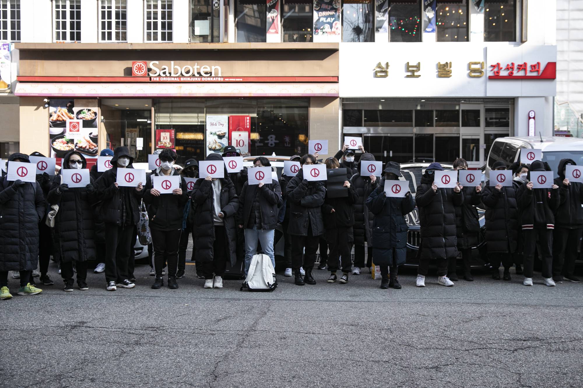 A rally in support of feminism outside of the offices of the opposition People Power Party in Seoul on Dec. 12. | Woohae Cho / The New York Times