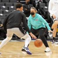 Former San Antonio Spurs assistant coach Becky Hammon (right), who has taken the head couching job for the WNBA\'s Las Vegas Aces, works with guard Bryn Forbes before the game against the Sacramento Kings at Golden 1 Center on Dec. 19. | DARREN YAMASHITA / USA TODAY / VIA REUTERS