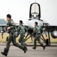 Taiwanese air force pilots during a military training exercise in Chiayi County, Taiwan, on Wednesday. Taiwan is bracing for more Chinese military patrols this year, after People\'s Liberation Army incursions more than doubled in 2021. | BLOOMBERG