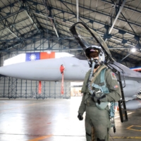 A Taiwanese air force pilot in front of a F-16V fighter jet during a military training exercise in Chiayi County, Taiwan, on Wednesday. | BLOOMBERG