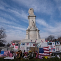 A memorial to Brian Sicknick, the police officer who was fatally injured when pro-Trump supporters stormed the U.S. Capitol in Washington. The total number of fatalities stemming from the assault has been contested amid a political battle over responsibility for the worst attack on the Capitol in centuries.  | ANNA MONEYMAKER / THE NEW YORK TIMES
