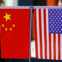 Tensions between China and the United States have unnerved Japanese businesses dealing with both countries, a survey has shown. | REUTERS