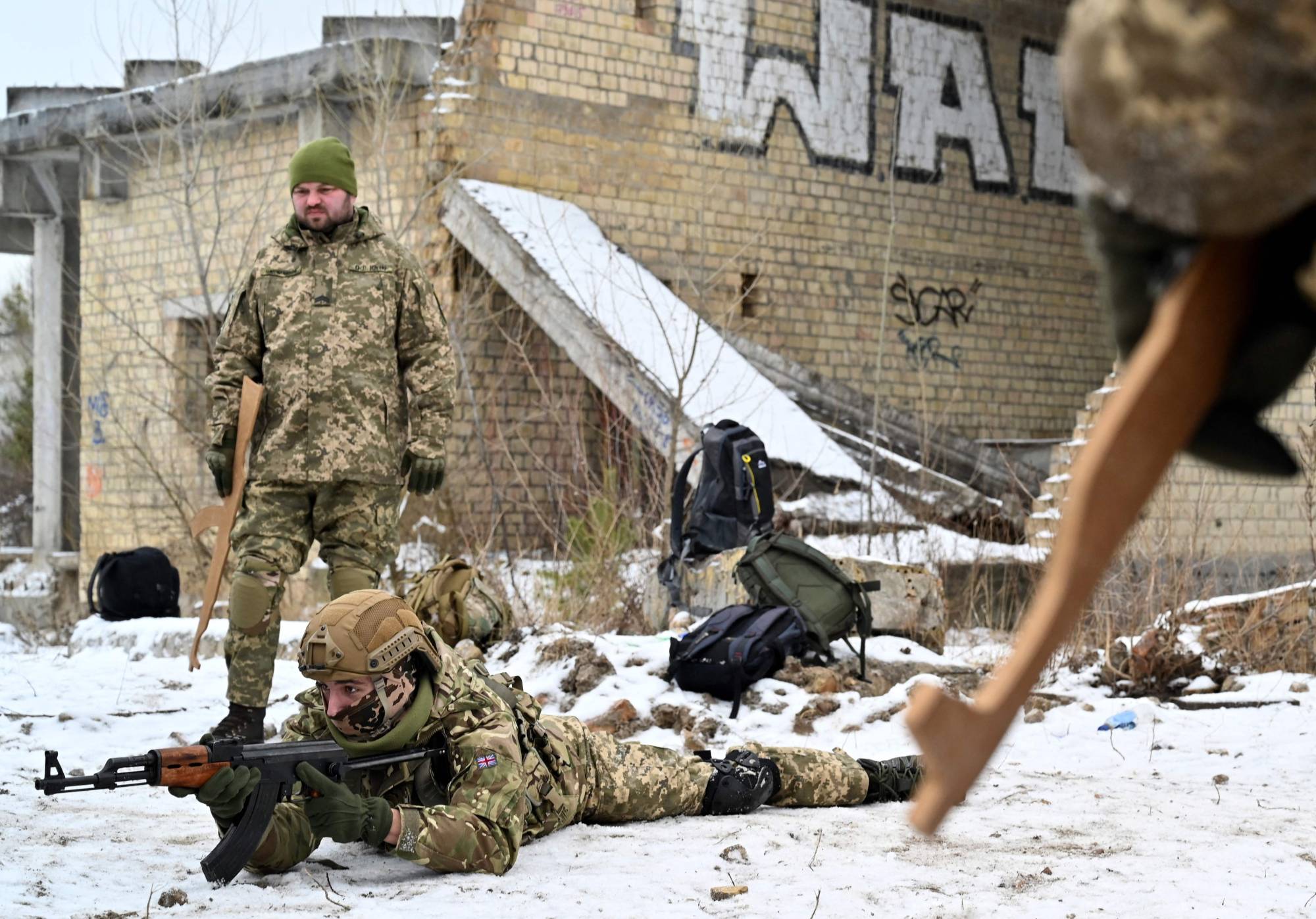 Ukrainian Territorial Defense Forces, the military reserve of Ukraine's armed forces, take part in an exercise near Kyiv on Dec. 25. | AFP-JIJI
