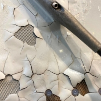 An image shows what appears to be paint peeling, cracking and exposed expanded copper foil (ECF) on the fuselage of a Qatar Airways A350 aircraft grounded by the Qatari regulator. | REUTERS