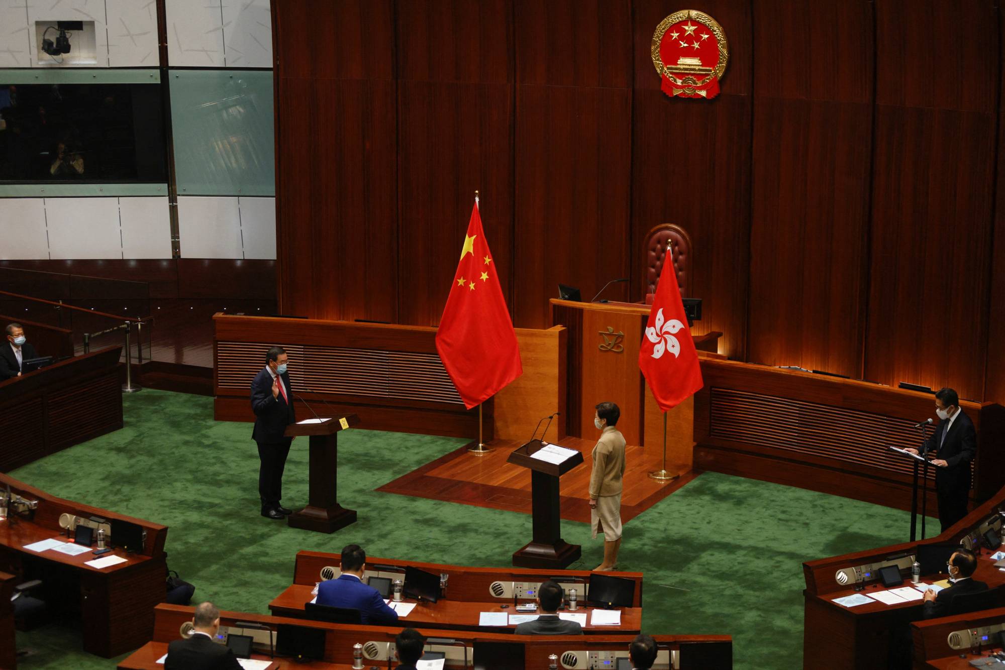 Newly elected lawmaker Andrew Leung Kwan-yuen takes his oath in front of Chief Executive Carrie Lam at the Legislative Council in Hong Kong on Monday. | REUTERS