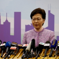 Hong Kong Chief Executive Carrie Lam speaks at a news conference in Beijing on Dec. 22.  | REUTERS