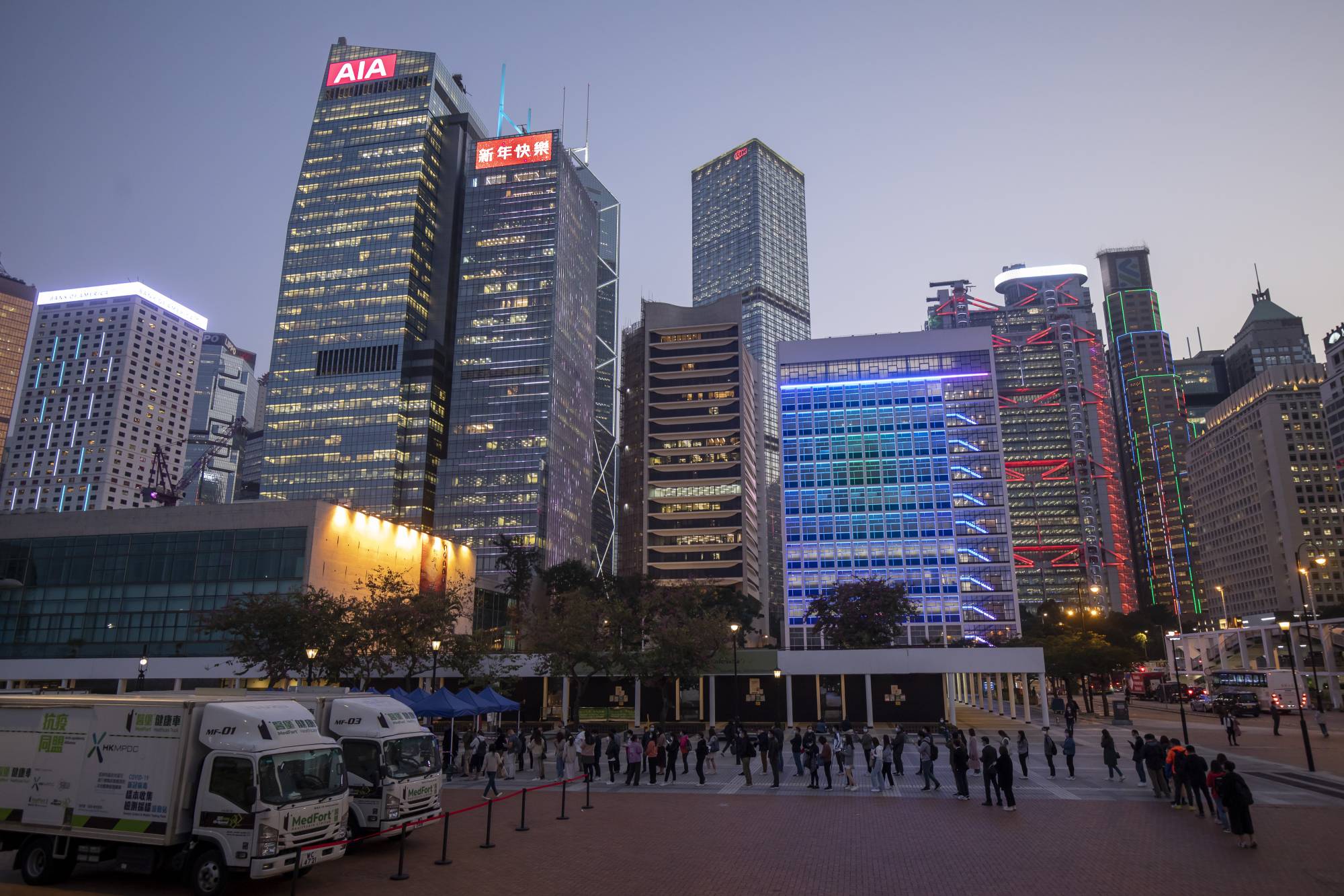 Hong Kong residents queue for a COVID-19 test on Friday. | Bloomberg 