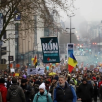 Demonstrators protest mandatory COVID-19 vaccines in Brussels on Dec. 19. | BLOOMBERG