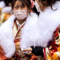 Women dressed in kimonos attend a celebration ceremony to mark Coming of Age Day at Todoroki Arena in Kawasaki on Monday. | AFP-JIJI