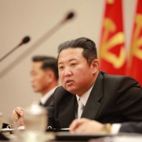 North Korean leader Kim Jong Un attends a meeting of top ruling party officials at the Party Central Committee Headquarters in Pyongyang in this image released on Jan. 1. | KCNA / KNS / VIA AFP-JIJI