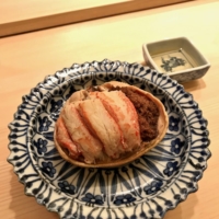 A course of \"kobako-gani,\" the meat and roe of the female crab served inside its carapace. | ROBBIE SWINNERTON