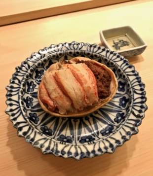 A course of 'kobako-gani,' the meat and roe of the female crab served inside its carapace. | ROBBIE SWINNERTON