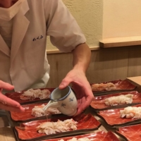 Chef Takayoshi Yamaguchi prepares crab for that evening’s meal. | ROBBIE SWINNERTON