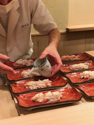 Chef Takayoshi Yamaguchi prepares crab for that evening’s meal. | ROBBIE SWINNERTON