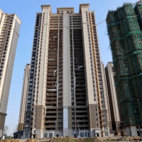 Residential buildings under construction at Evergrande Cultural Tourism City, a project developed by China Evergrande Group, in Taicang, Jiangsu province, China, in September. | REUTERS
