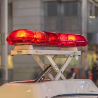 The flashing red lights of a police car don\'t always herald help for members of the non-Japanese community.  | GETTY IMAGES