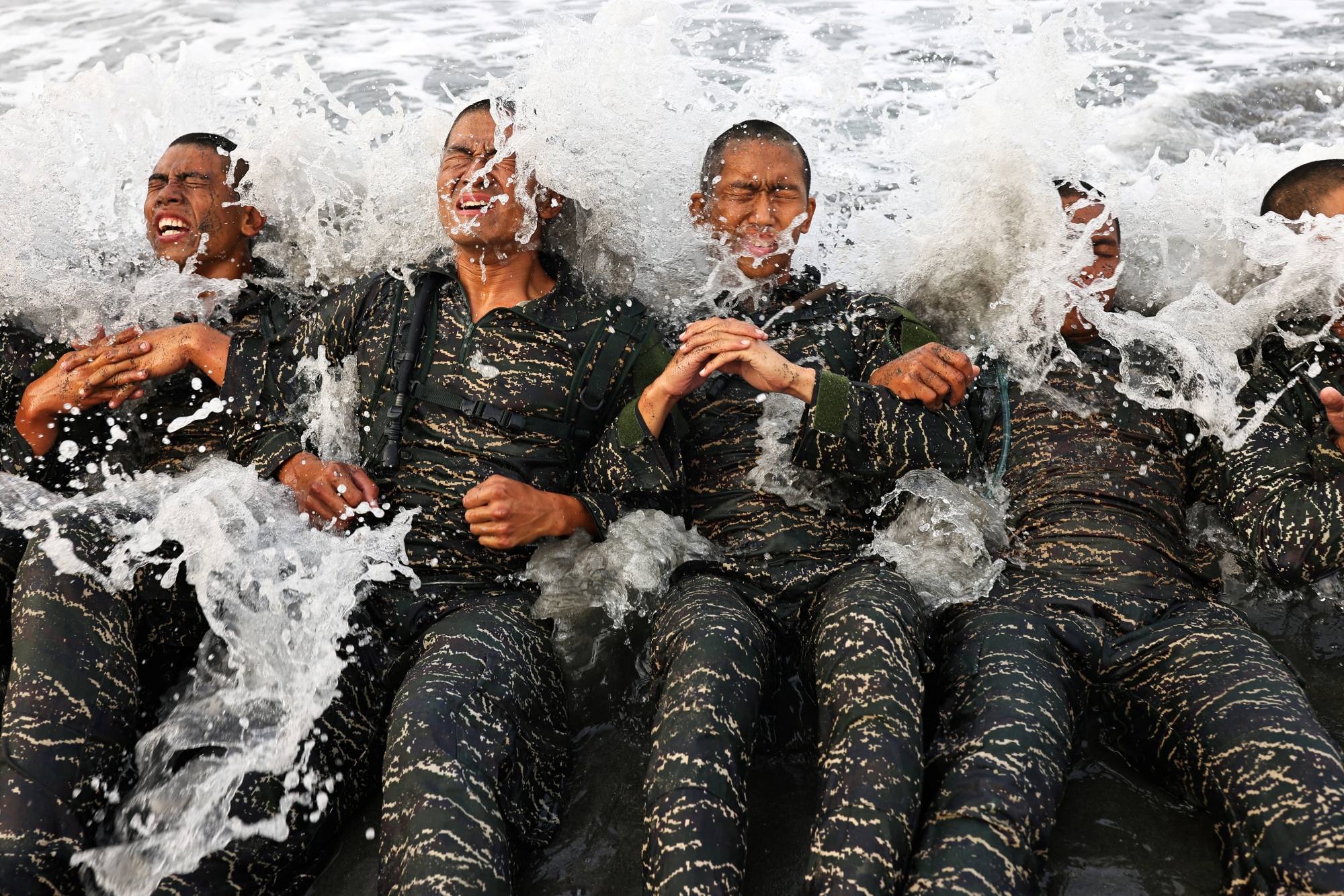 ARP trainees battle the waves while completing training exercises on Dec. 18. | Reuters