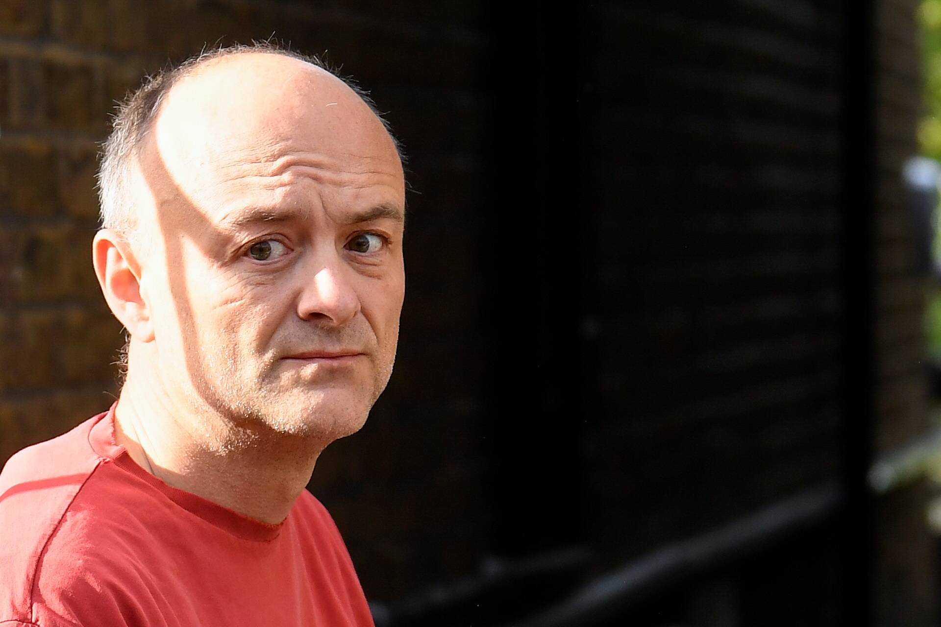 Dominic Cummings, former special adviser to British Prime Minister Boris Johnson, looks on outside of his house, in London in May last year. | Reuters