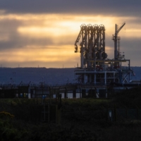 Pipelines to transfer LNG from ship to shore at the National Grid\'s import terminal on the Isle of Grain near Rochester, U.K., on Jan. 4. Natural gas prices in Europe started the year extending the sharp drop seen in the last month as rising flows eased concerns that supplies would be lacking during the winter. | BLOOMBERG
