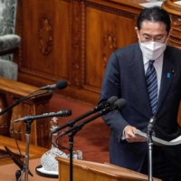 Prime Minister Fumio Kishida prepares to deliver a policy speech during a Lower House plenary session in Tokyo on Monday. | AFP-JIJI