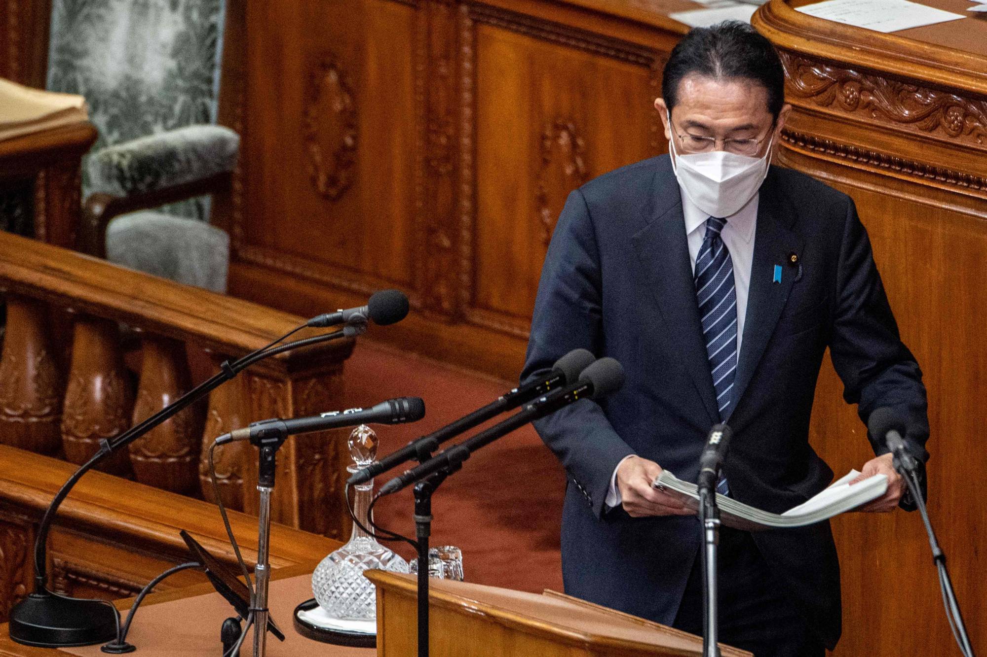 Prime Minister Fumio Kishida prepares to deliver a policy speech during a Lower House plenary session in Tokyo on Monday. | AFP-JIJI