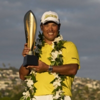 Hideki Matsuyama poses with the trophy after winning the Sony Open in Honolulu on Sunday. | USA TODAY / VIA REUTERS