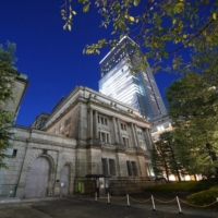 The Bank of Japan maintained its negative interest rate but raised its forecast for prices during a policy meeting Tuesday. | BLOOMBERG