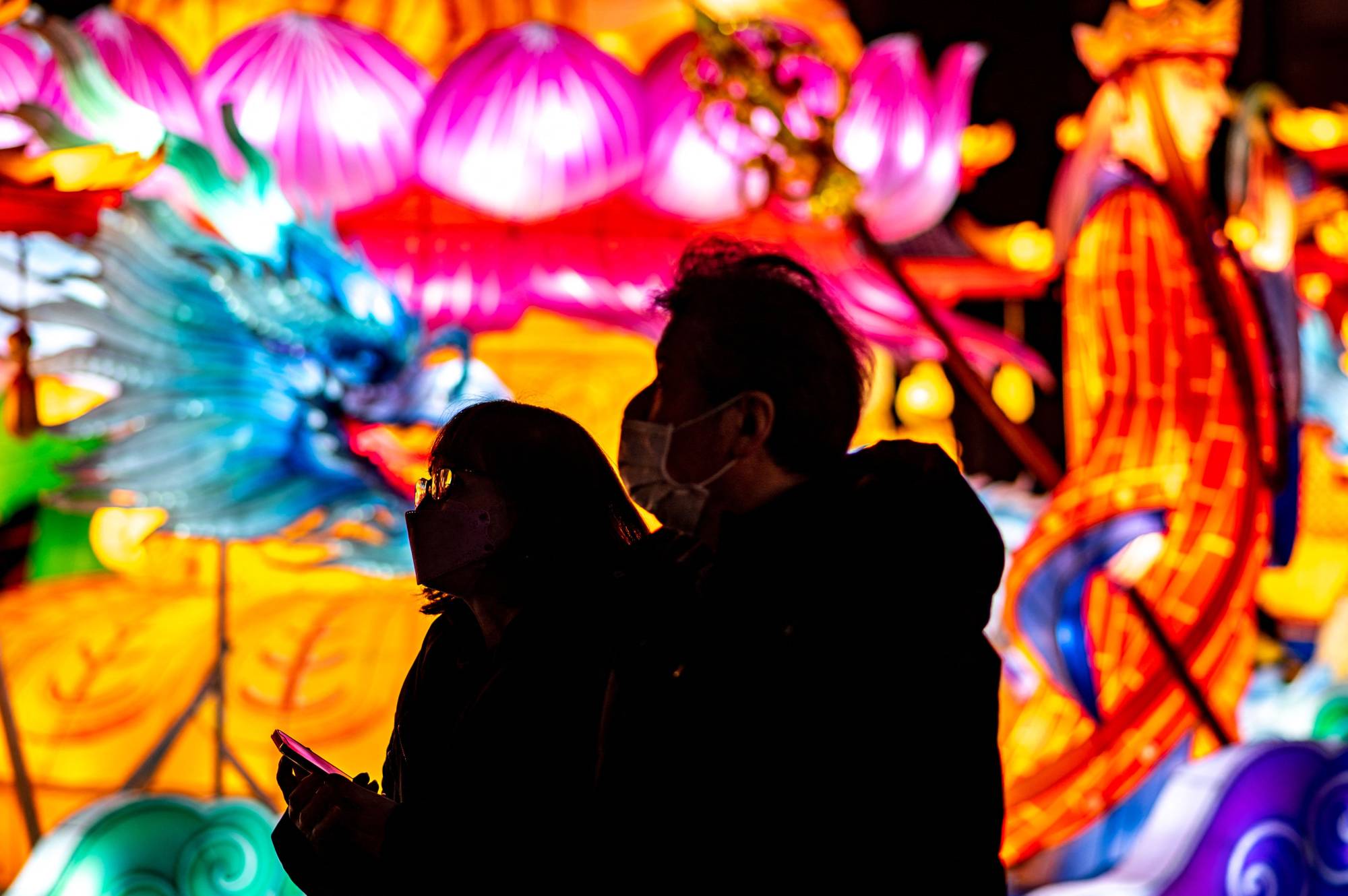 People walk past festive lantern installations at Yamashitacho Park in Yokohama on Sunday ahead of the Lunar New Year. | AFP-JIJI