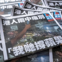 Copies of the final edition of the Apple Daily newspaper in Hong Kong, China, on June 24, 2021. Hong Kongs pro-democracy Apple Daily newspaper, which cheered on the city\'s anti-China protest movement in 2019, is shutting down after authorities used a national security law to arrest its top editors. | BLOOMBERG