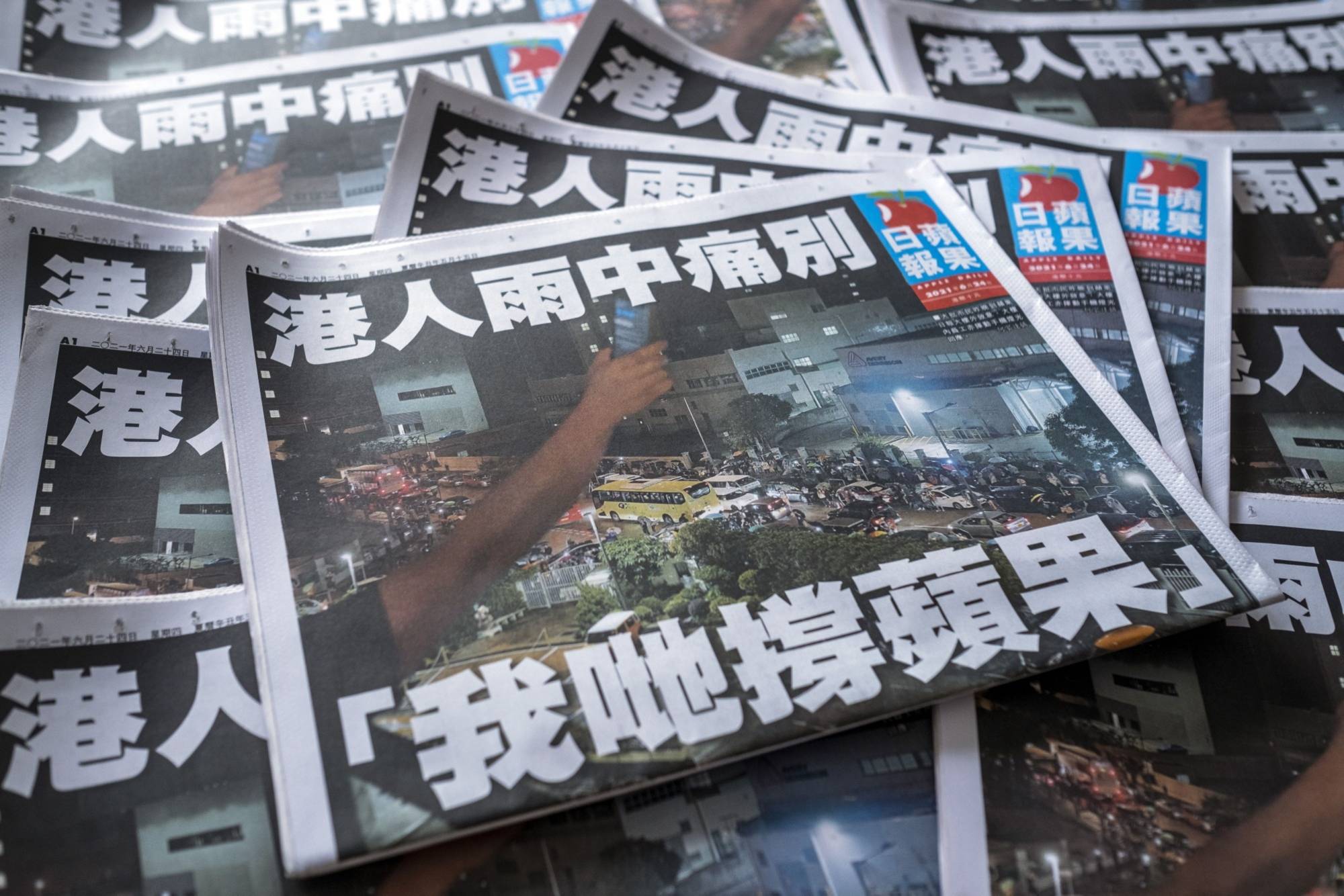 Copies of the final edition of the Apple Daily newspaper in Hong Kong, China, on June 24, 2021. Hong Kongs pro-democracy Apple Daily newspaper, which cheered on the city's anti-China protest movement in 2019, is shutting down after authorities used a national security law to arrest its top editors. | Bloomberg