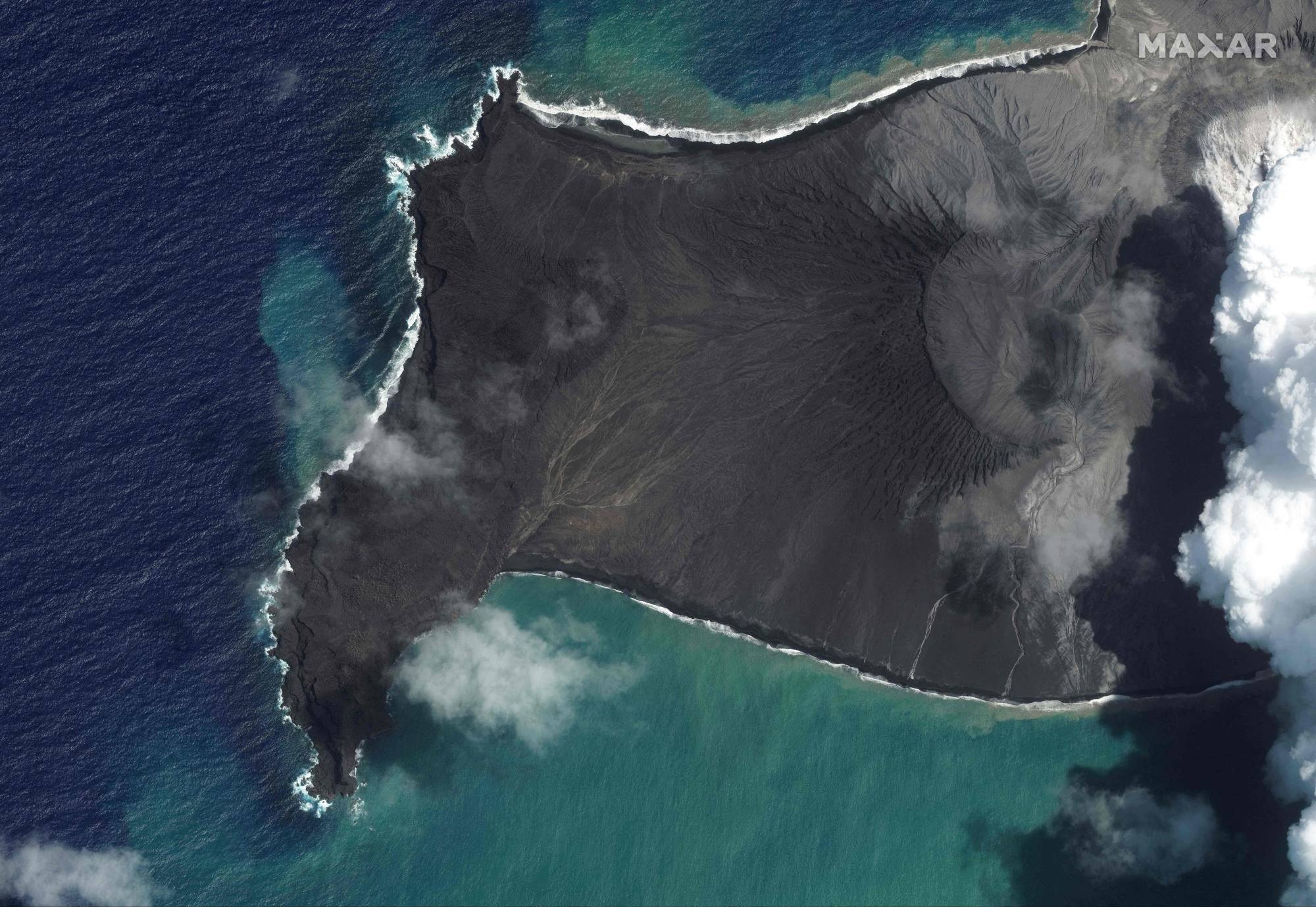 Smoke and ash being released by the Hunga-Tonga - Hunga-Haa'pai volcano just over one week before a massive eruption destroyed most of the island on Saturday, devastating Tonga and causing a tsunami across the Pacific Ocean. | 2022 Maxar Technologies / AFP-JIJI